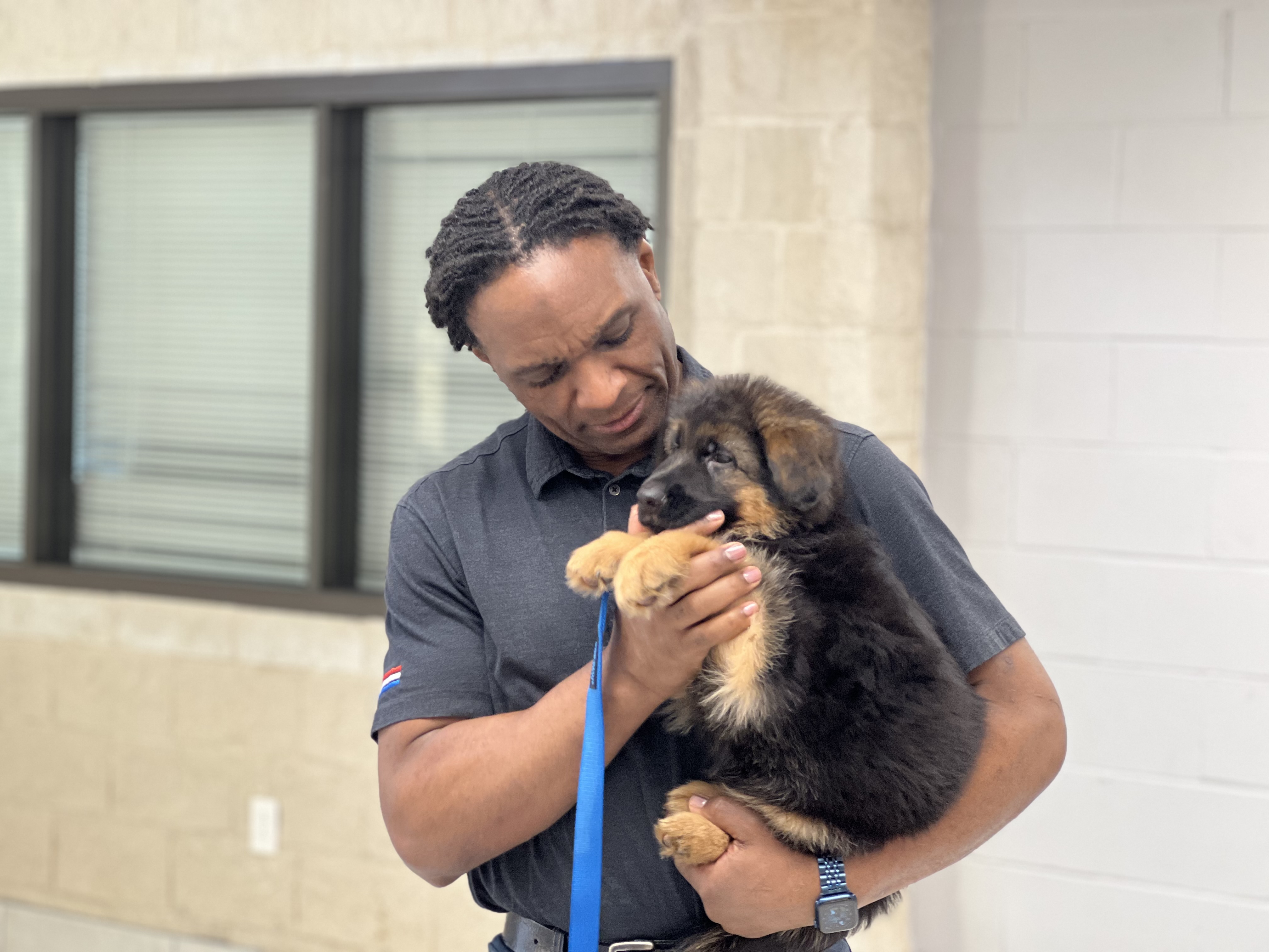 Lorenzo holding a puppy